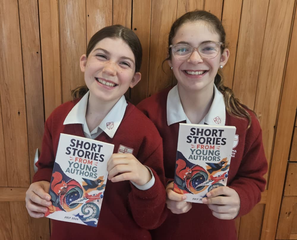 Proud Authors holding copies of Short Stories from Young Authors