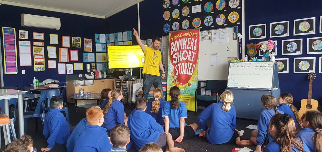 Tom working with a class during a school visit