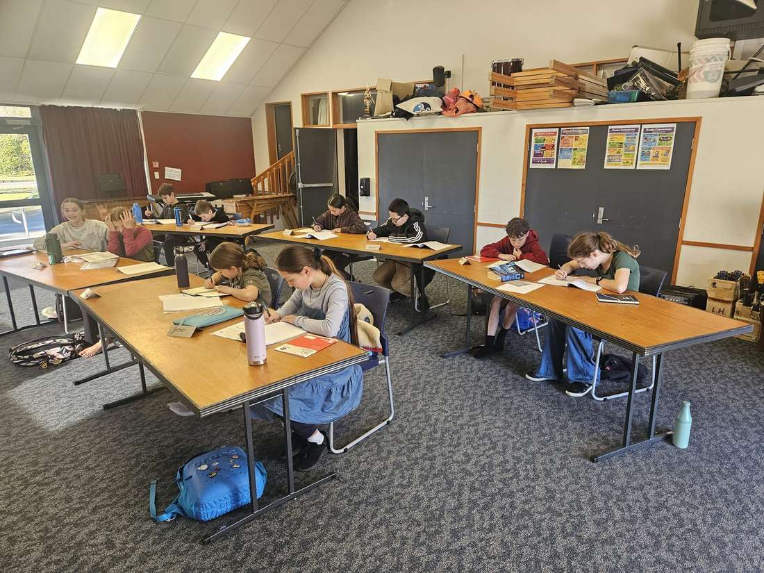 Kids writing at a Young Authors workshop